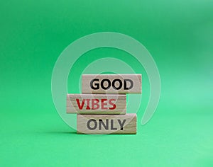 Good Vibes only symbol. Concept words Good Vibes only on wooden blocks. Beautiful green background. Business and Good Vibes only