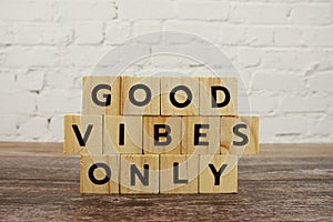 Good Vibes Only word alphabet letters on wooden background