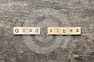 good vibes word written on wood block. good vibes text on table, concept