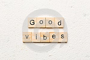 good vibes word written on wood block. good vibes text on table, concept