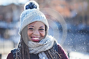 Goodby autumn, hello winter. Portrait of a beautiful young woman enjoying a wintery day outdoors.