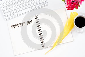 Goodbye 2017 word and top viwe of modern workplace on white back