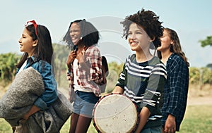 Goodbye cabin fever, hello fun. a group of teenagers walking through nature together at summer camp.