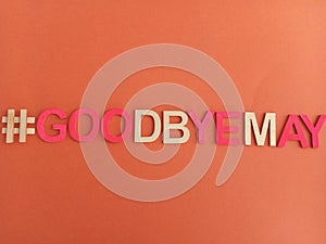 #goodbyemay goodbye may sign on an orange background