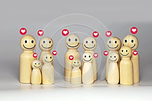 wooden figures of big family members, grandparents, uncles, aunts, cousins, family relationship symbols photo