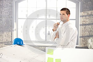 Goodlooking architect making plans