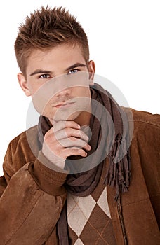 Goodlooking man in coat and scarf