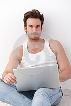 Goodlooking man with laptop