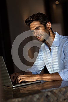 Goodlooking young man with laptop computer