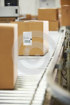 Goods On Conveyor Belt In Distribution Warehouse