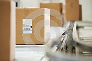 Goods On Conveyor Belt In Distribution Warehouse