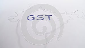 Goods And Services Tax on an India map outline on a plain white background