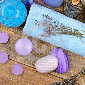 Goods for the spa: soap, sea salt, towel, oil of lavender on woo