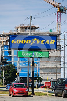 The Goodyear Tire Rubber Company banner. An American manufactures tires for passenger cars, buses, trucks, airplanes and racing