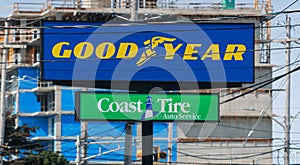 The Goodyear Tire Rubber Company banner. An American manufactures tires for passenger cars, buses, trucks, airplanes and racing