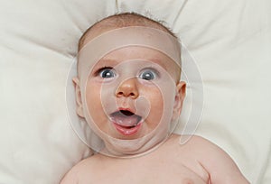 Goofy Adorable excited smiling baby open mouth laughing photo