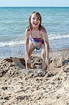 Goofy girl playing on the beach