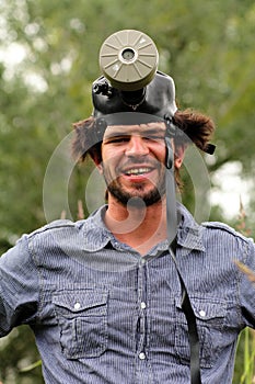 Goofy young man with a gas mask photo