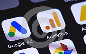 Google Ads, Analytics icon app on the screen smartphone background closeup