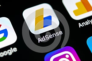 Google AdSense application icon on Apple iPhone X screen close-up. Google AdSense app icon. Google AdSense application. Social med