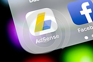 Google AdSense application icon on Apple iPhone X screen close-up. Google AdSense app icon. Google AdSense application. Social med