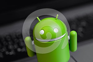 Google Android figure on notebook background closeup