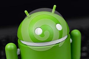 Google Android figure on notebook background macro closeup