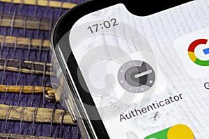 Google authenticator application icon on Apple iPhone X smartphone screen close-up. Google Authenticator app icon. Social network.