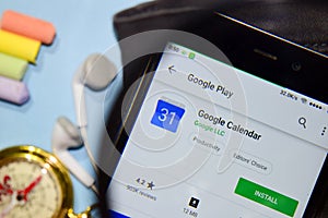 Google Calendar dev app with magnifying on Smartphone screen.