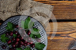 Gooseberries on a tray with a coarse cloth napkin