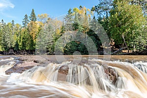 Gooseberry Falls Flowing Through Minnesota Autumn Colors