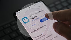 Installing GoPay Application on Android smartphone.