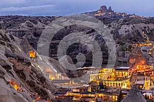 Goreme City at twilight, Famous tourist center of balloon fligths in Cappadocia, Turkiye, Aerial view twilight Goreme City from