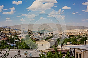 Goreme, Turkey - panorama view of the town of Goreme in Cappadocia, Turkey with fairy chimneys, houses, and unique rock formations