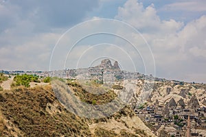 Goreme, Turkey - panorama view of the town of Goreme in Cappadocia, Turkey with fairy chimneys, houses, and unique rock formations