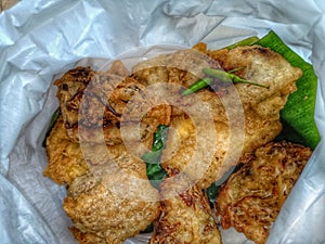 Gorengan refers to a variety of deep-fried snacks in Indonesian cuisine. photo