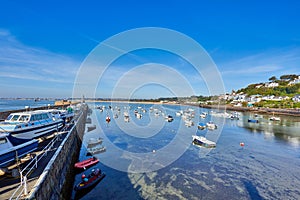 Gorey harbour with blue sky and boats