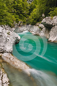Gorge of Koritnica river in Slovenia with a bridge in the backround