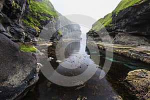 The gorge landscape as seen from the harbour of Gjogv village