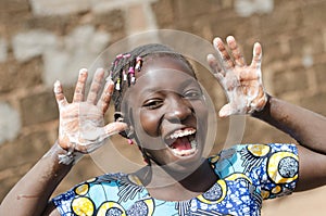 Gorgeous African Black Girl with Soapy Hands Outdoors photo