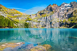 Gorgeous alpine lake with high mountains and glaciers, Oeschinensee, Switzerland