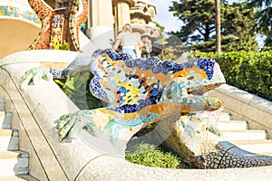 Gorgeous and amazing Park Guel in Barcelona. Barcelona Park Guell of Gaudi Snake and four Catalan bars in modernism