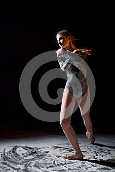 Gorgeous athlete elegant lady in pointe shoes, isolated on black studio background