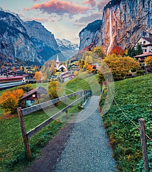 Gorgeous autumn view of great waterfall in Lauterbrunnen village. Splendid outdoor scene in Swiss Alps, Bernese Oberland in the ca