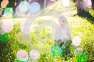 Gorgeous baby girl on a sunny meadow portrait
