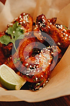 Gorgeous baked chicken wings on a plate close-up