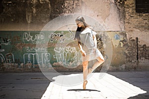 Gorgeous ballet dancer in urban setting