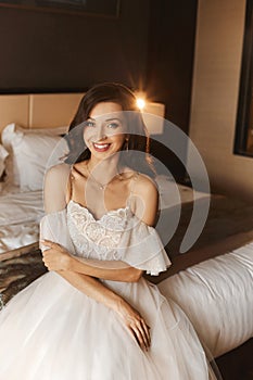Gorgeous beauty young bride portrait. Beautiful bride with wedding makeup and jewelry. Bridal fashion model with blue
