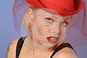 Gorgeous blond girl in fifties pinup hat