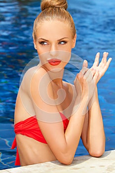 Gorgeous blonde lady in the pool
